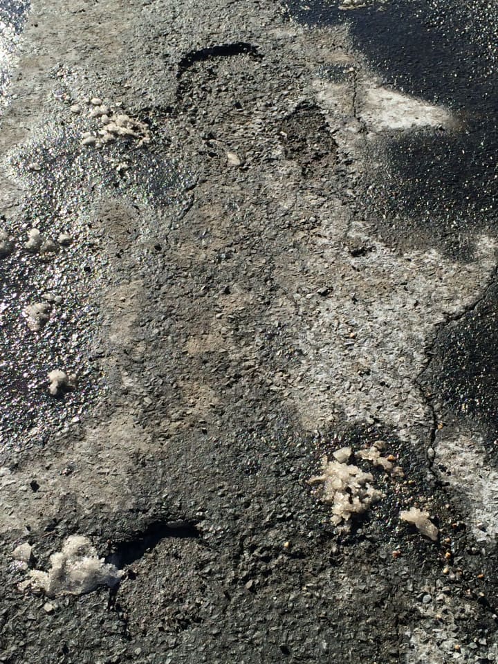 These small holes in Harbor Road in Southport may not seem like a lot, but over time they can grow to become a dangerous pothole if there are enough cracks in the pavement.