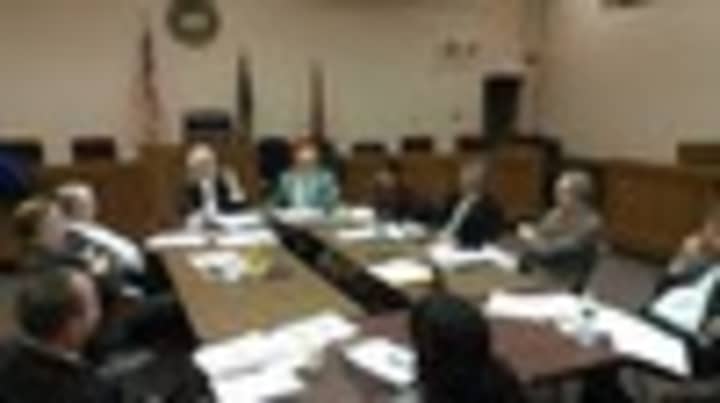The Cortlandt Town Board, pictured here in 2013, approved a salary resolution that will pay 12 employees a six-figure salary. 