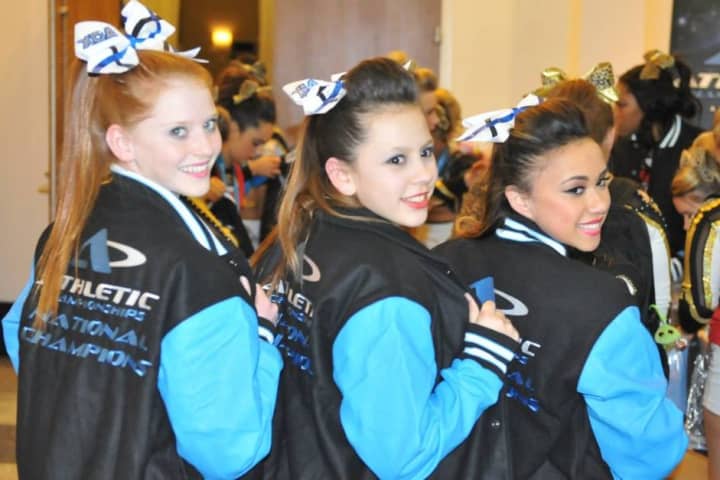 Xtreme Cheer Inferno&#x27;s Carson Allsteadt, Victoria Leon and Tori Ramos showing off their winning leather jackets