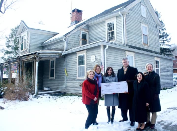 Rep. John Shaban and Sen. Toni Boucher are present with Weston First Selectman Gayle Weinstein and Friends of LaChat member Carol Baldwin to accept the check from Helen Higgins, executive director of the Connecticut Trust for Historic Preservation.