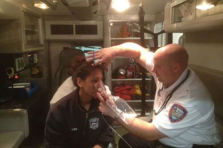 Nick Franzoso, captain for the Ossining Volunteer Ambulance Corps, simulates work inside of an ambulance. The Ossining Lions Club recently presented the Ossining Volunteer Ambulance Corps with the Robert J. Uplinger Distinguished Service Award.
