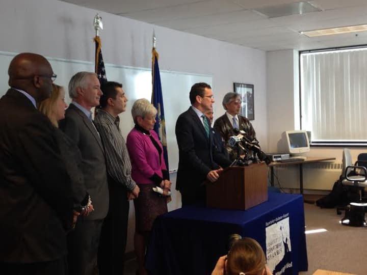 Gov. Dannel Malloy proposes an increase in the minimum wage to $10.10 per hour by 2017 during an event Tuesday in Bridgeport.