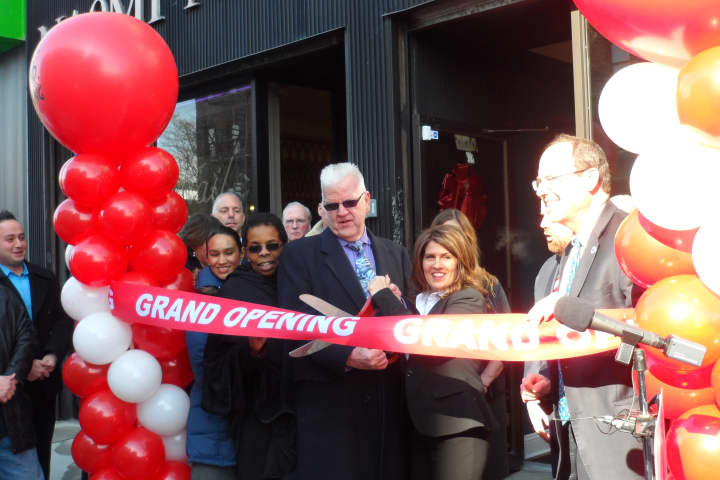 Irene Amato cuts the ribbon for the grand opening of A.S.A.P. Mortgage in Yonkers on Tuesday.