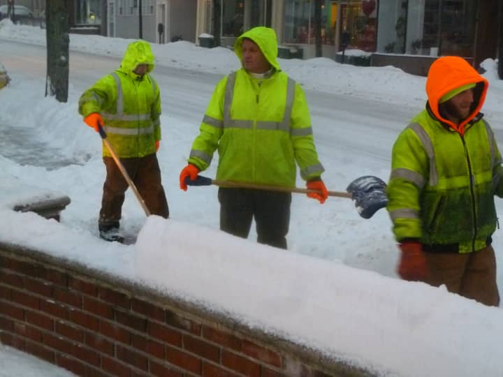 Hastings Department of Public Works personnel clear sidewalks during Wednesday&#x27;s storm