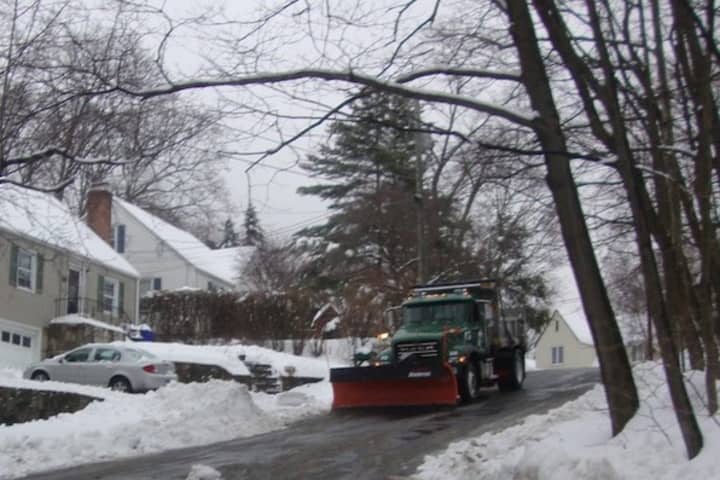 Plows arrive on Fairfield Terrace in Norwalk to clear the streets Wednesday. It is important to clear the snow and slush before it refreezes and forms black ice. 