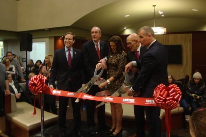 Assemblyman David Buchwald, Deputy County Executive Kevin Plunkett, Life Time general manager Susan Mistri, Harrison Mayor Ron Belmont and Life Time Vice President Jeff Zwiefel cut the ribbon on the new Harrison location.