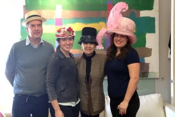 ArtsWestchester workers show off creative hats.