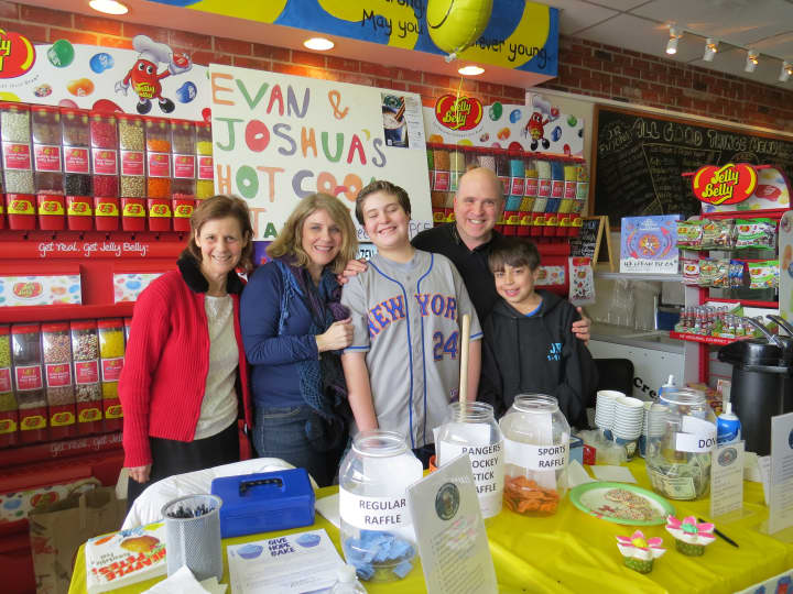 Nancy Joselson and the Greenberg family at their hot cocoa stand in Scarsdale.