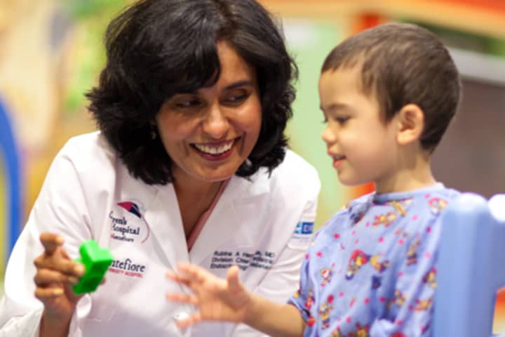 Rubina Heptulla, M.D., chief of the Division of Pediatric Endocrinology and Diabetes at The Childrens Hospital at Montefiore helps a youngster.