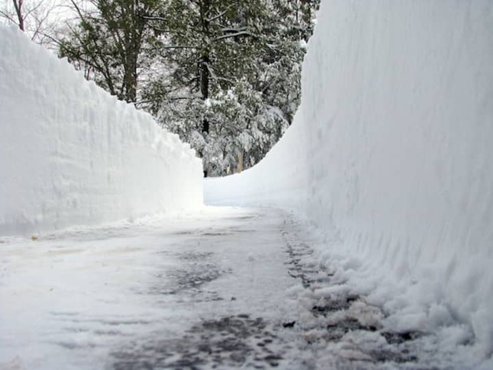 Snow is piled up on a driveway on Ferndale Drive in Easton from a storm in 2011. 