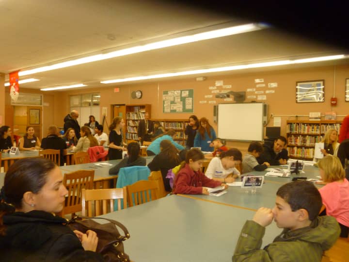 Students attend a forum about the Common Core held at Cooper Beech Middle School on Tuesday.