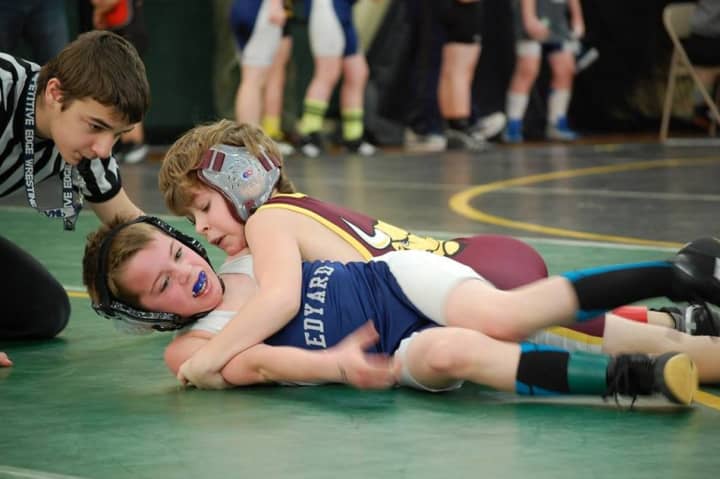Norwalk&#x27;s Jack Cahill clamps down on an opponent.