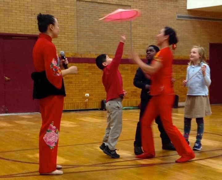 Chapel School students take part in the interactive part of the Chinese New Year assembly. 