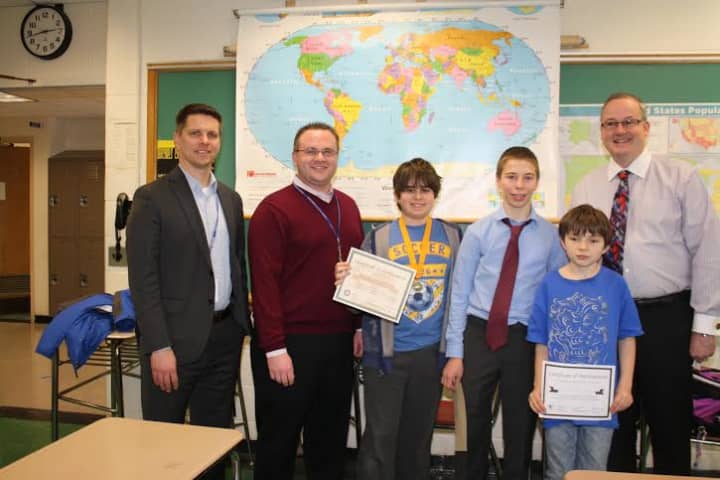 From left, Middle School Assistant Principal Josh Elder, Middle School Principal Scott Wynne, Matthew DeMarco, Adam Ginsburg, Elias Dube and Superintendent of Schools Walter Moran.