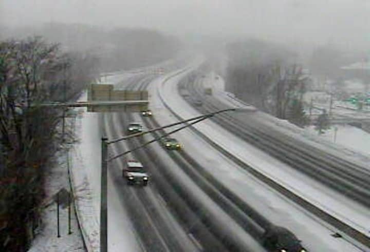 Traffic is light and snow is beginning to coat I-5 northbound at Exit 3 for Arch Street in Greenwich on Tuesday morning. 