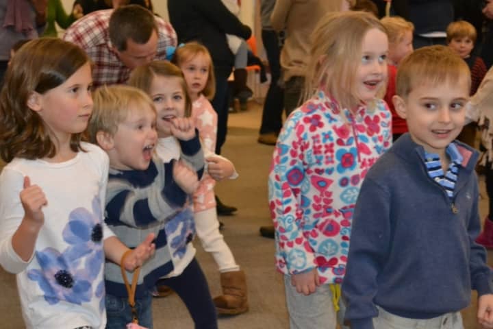 Brynn Forlizzi, Timmy FitzPatrick, Tanner Shanley, Lily FitzPatrick and Tommy Bogdan dance along to Ray &amp; Jay Music for Everybody at the Opus Snowflakes, Songs &amp; Slices concert.