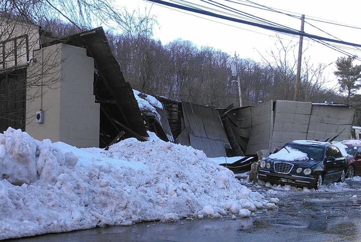 A roof and walls of a garage on North Greeley Avenue collapsed during the snowstorm. 