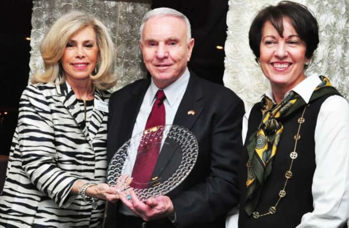 Foundation Executive Director Lyn McCarthy presents Fairfield Fire Chief Richard Felner and his, wife, Linda, with the St. Vincent Medical Center Foundation Center&#x27;s David Felner Caregiver Award. 