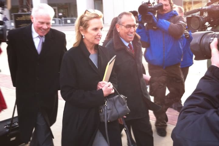 Kerry Kennedy exits the Westchester County Courthouse in White Plains with her lawyers following the first day of her trial Monday.