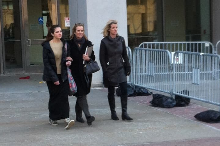 Bedford resident Kerry Kennedy (center) exits the Westchester County Courthouse in White Plains Tuesday following the second day of her trial.