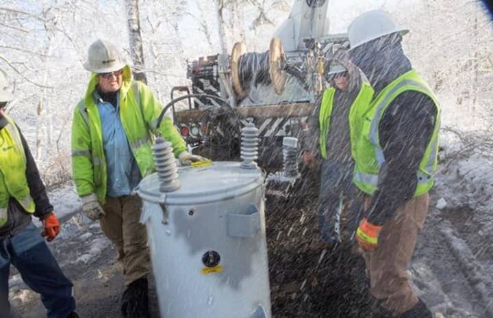 Connecticut Light &amp; Power crews help to restore power during a storm on Cape Cod on Feb. 18. Workers are preparing for the storm headed for Fairfield County late Sunday,. 