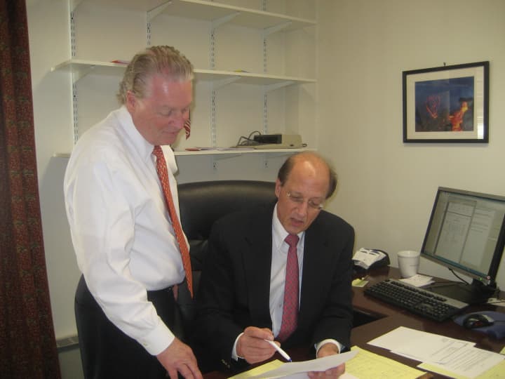 Fairfield First Selectman Mike Tetreau works on the 2014-15 budget with Robert Mayer, the towns CFO.