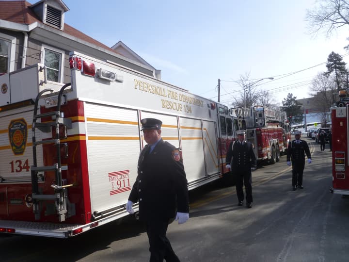 Firefighters gather at the funeral for Kevin Bristol, who died of a heart attack Monday. 