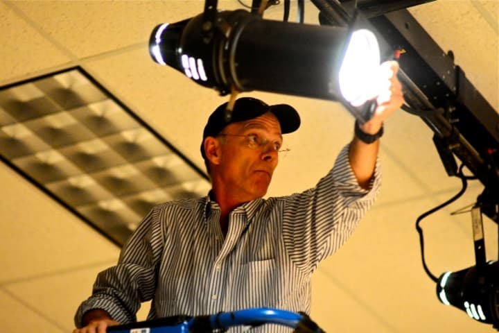 Lighting designer for &quot;Sirens&quot;, Darien Arts Center board member and member of the DAC Stage Committee, Michael DuPont, adjusts the lighting at the DAC Weatherstone Studio for one of the upcoming spring shows.