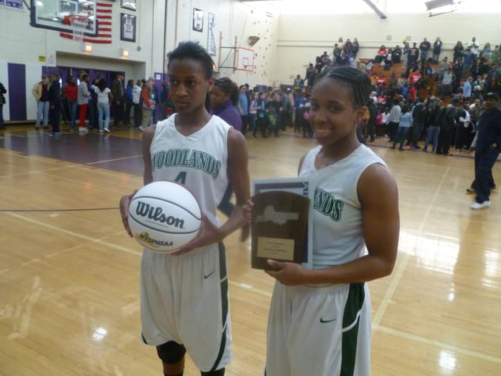 Teisha Hyman, left, and team leader Imani Tilford will lead Woodlands into the state Class B semifinals Friday, March 14.