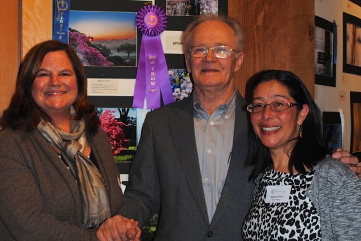 Tree Conservancy of Darien board members stand with &quot;Celebration of Trees&quot; photo contest winner Stanley Malecki. From left: Karen Hughan, TCD board member, Stanley Malecki, winner of Best in Show, and Sabina Harris, TCD board member.