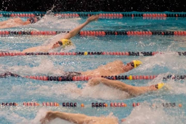 Westport&#x27;s Connor Rainey(top) competes in the backstroke along with Wahoos teammates Bobby McDowell (center) and Tommy Kealy.