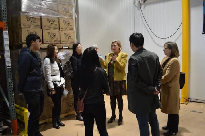 Chinese college students, who were winners of a PepsiCo contest, visit Food Bank for Westchester. 