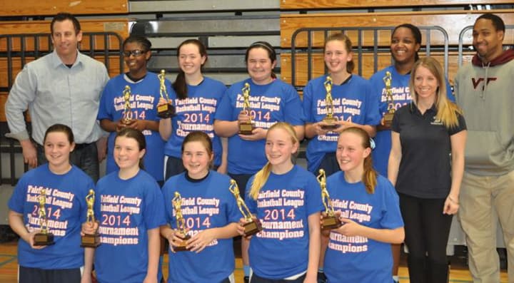 The Wilton 7th grade girls travel basketball team celebrates its Fairfield County Basketball League championship.