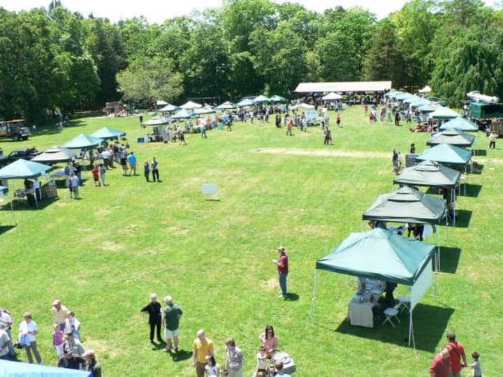 A panoramic view of the lineup of Connecticut Tree Festival booths at Norwalk&#x27;s Cranbury Park, as seen from a cherry picker.