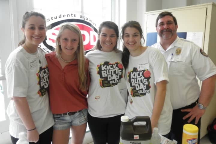 Pictured are SADD members Colleen Heaney, Haley Close, Sloane Clarke, Caroline Feehan, and Fire Marshal Bob Buch at Kick Butts Day at Middlesex Middle School, one of the many national events in which the Darien chapter of SADD participates.