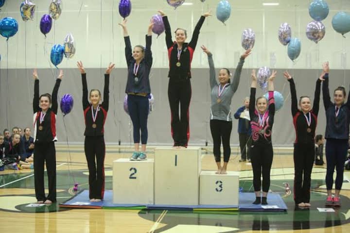 Ridgefield&#x27;s Erika Marr stands on the top step of the podium after winning the Level 9 14-15 age group All-Around title at the U.S. Gymnastics Connecticut State Championships.