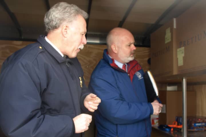 Fairfield Assistant Fire Chief Art Reid, left, and Health Director Sands Cleary inspect emergency response trailers in 2010.