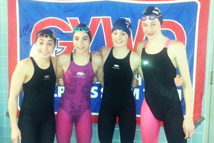 Left to right, Taylor Schinto, Kate Hazlett, Emmy Sammons and Suzy Ryckman won the 13-14 200 free relay for the Greenwich YWCA Dolphins.