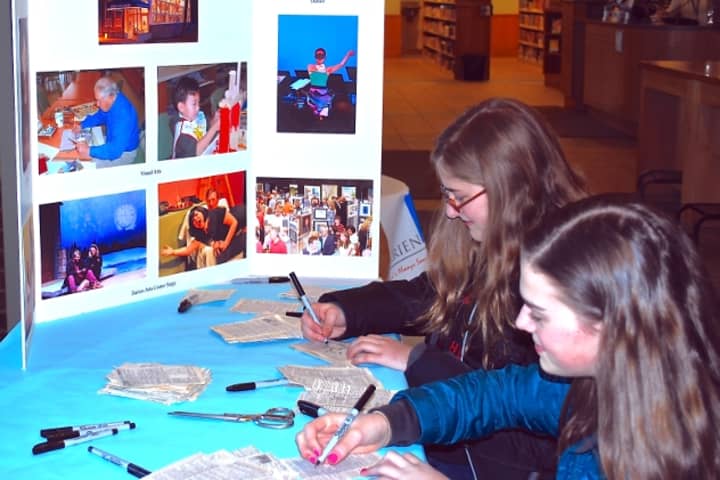Middlesex Middle School students Alyssa Farrell and Chloe Sheehan participate in the Draw On! Goes Green community art project sponsored by the Darien Arts Center. 