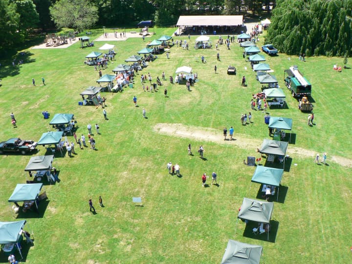  A panoramic view of the lineup of tree festival booths at Cranbury Park, as seen from a cherry picker.