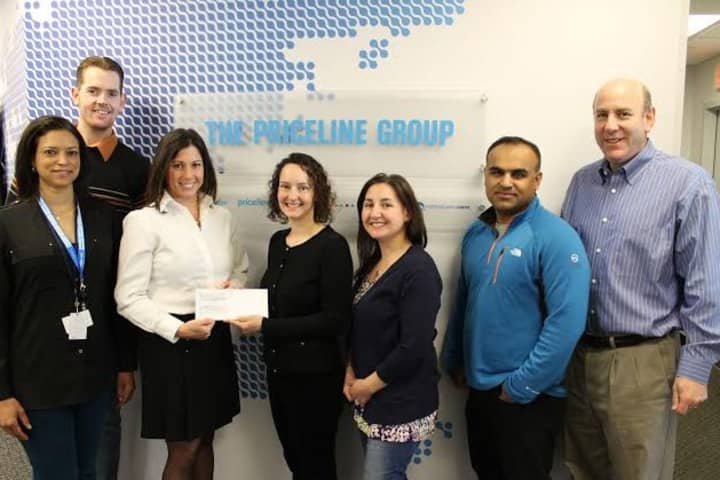 Family Centers Director of Community Engagement Jennifer Flatow (second from left) accepts a check from Priceline.com employees (l-r) Angela Jamerson, Ben Harrell, Jill Saverine, Eleana McNeill, Baiju Thakkar and Ken Weil.
 