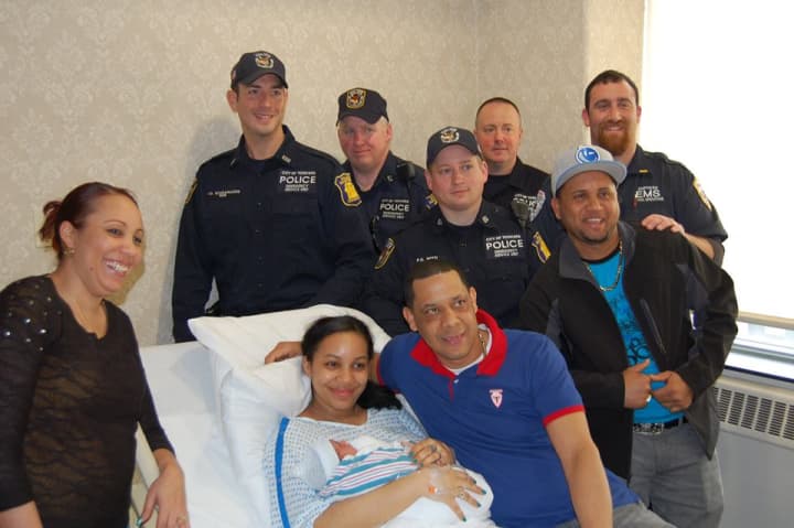 Mother, father, baby and family with Yonkers ESU Officers (left to right) Scaramuzzo, Twomey, Betti, Sgt. DiDonato, and Empress Lt. Michael Blecker 