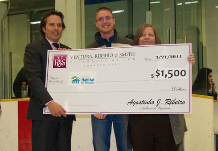 Danbury law firm Ventura, Ribeiro &amp; Smith recently teamed up with the Danbury Whalers to raise money. Derek Roy, center, the organizations Strategic Planning  Chairman, and Executive Director Fran Normann, right, accepted the check. 