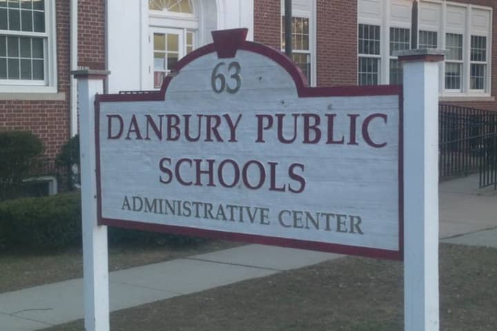 The mother of a Danbury middle school student is suing the Board of Education after her daughter was attacked and left unconscious in a classroom recently. 