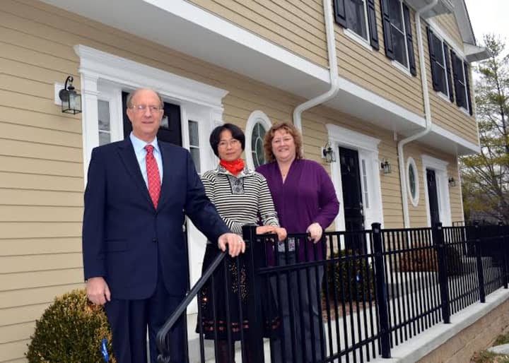 From left, CMS Bank Vice President Gerald Calvario; Comstock Heights homeowner Elly Chiu and Terry Fleischman of the Housing Action Council.