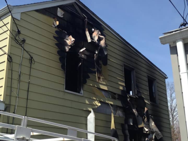 The New Rochelle residence was badly damaged by the fire on Monday.