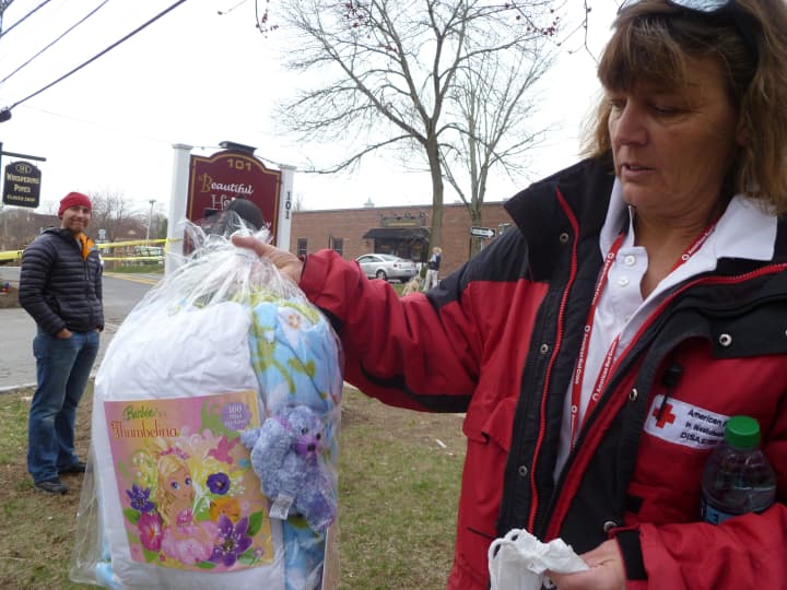 Carolyn Sherwin, a spokeswoman for the American Red Cross, shows a care package given to a four-year-old displaced by a fire. 