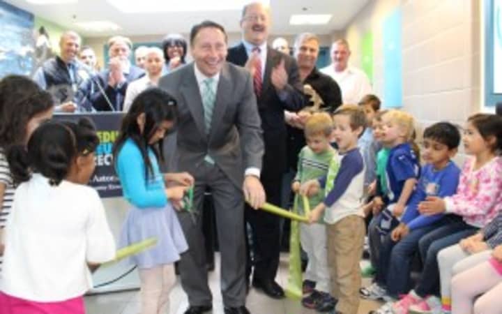 County Executive Rob Astorino and kindergartners from Edgemont&#x27;s Seely Place School cut the ribbon at the opening of the Recycled Material Art Gallery. 