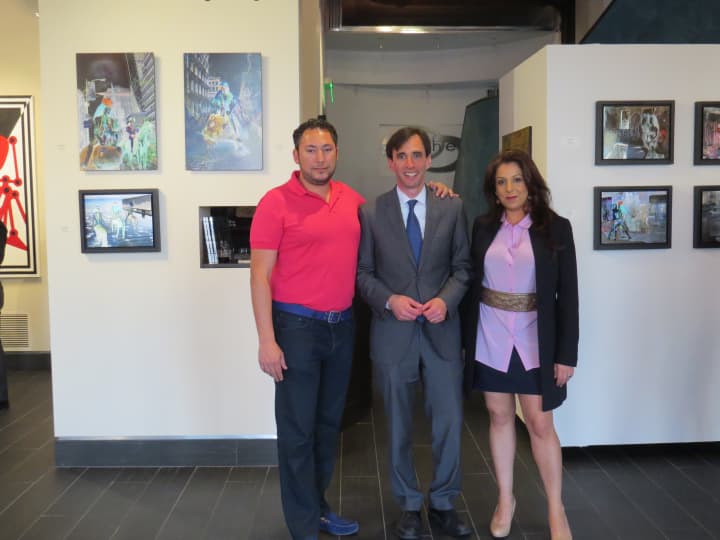 New Rochelle Mayor Noam Bramson, Mahlstedt Gallery Executive Director Oshi Rabin, right, and Ephraim Rabin, left, founder and chief executive officer of Parchem pose in front of some of the featured art. 