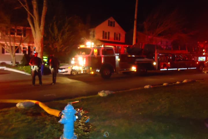 Norwalk firefighters respond to a basement fire at a two-family home on Reservoir Avenue.